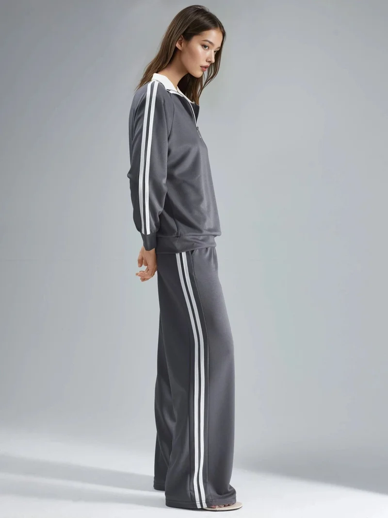 هيكاب طقم نسائي قطعتين مخطط بأرجل واسعة وياقة بسحاب من مجموعة بيرسان